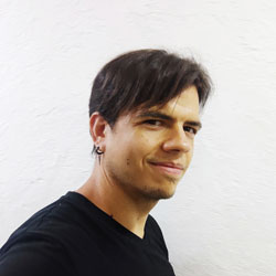Portrait of Daniel in front of a light background